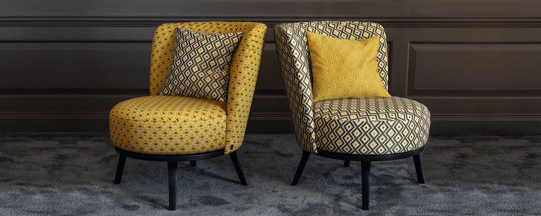 Jab Anstoetz yellow fabric covered chairs