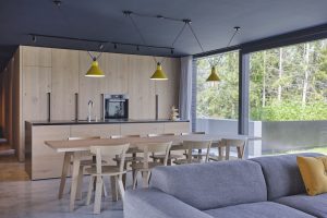 Oak Kitchen with oak table, oak chairs and grey couch