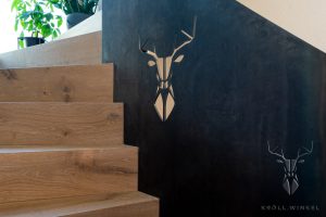 Oak stair with metal railing with stag