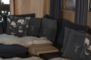 Loaden couch with woolen stag pillows