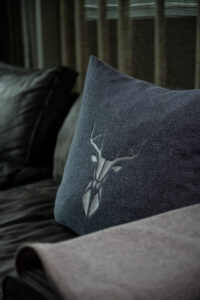 Loden pillow steel blue with stag logo