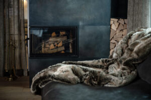 Cozy fireplace with fur blanket
