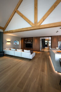 Livingroom oak floorboards, light couch