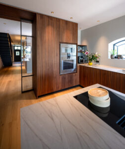 white marble kitchen with walnut kabinets