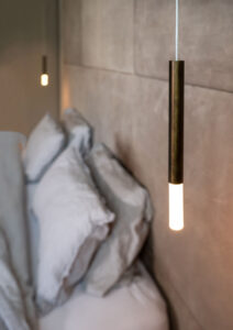Bronze pendant lights hanging by the bedside