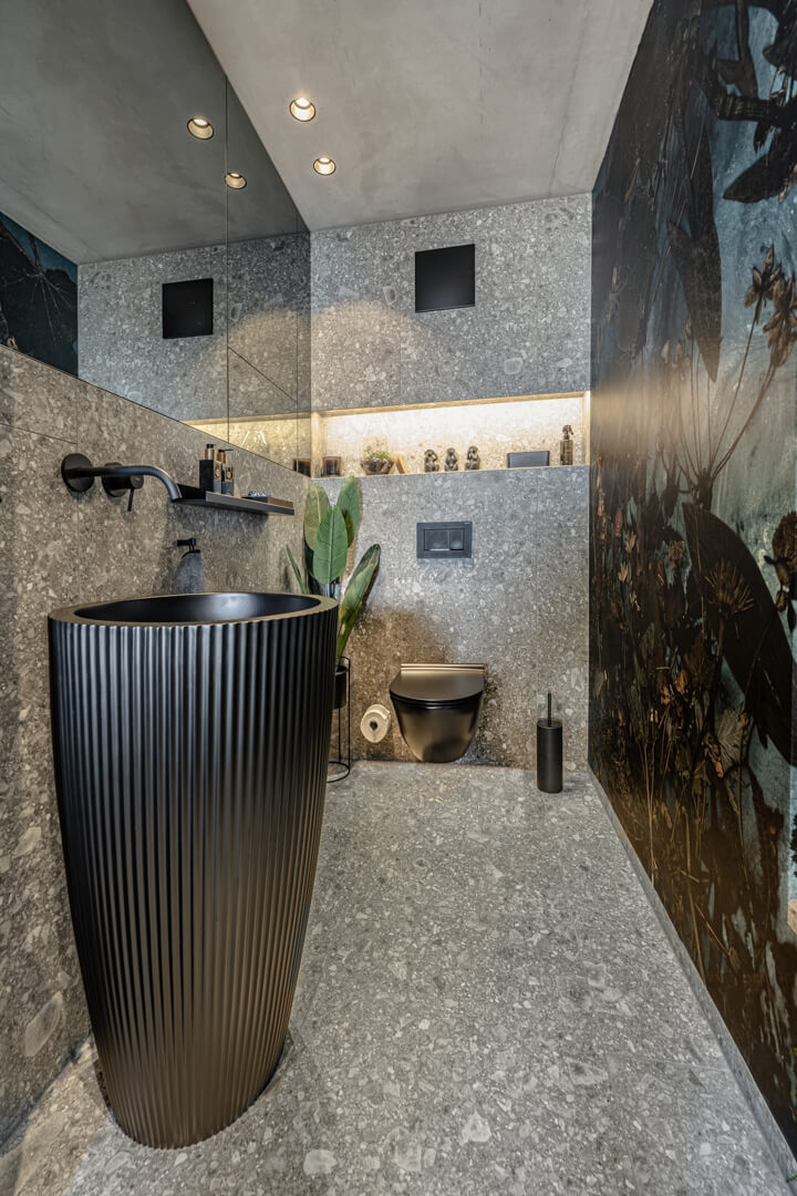 Restroom grey tile with floral jungle wallpaper