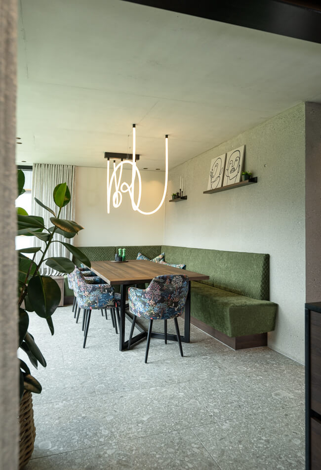 Dining room with green custom bench