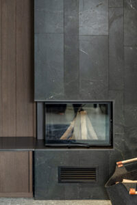 Dark stone fireplace