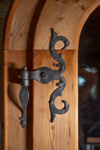 Elegant fine black steel hinges for traditional wooden doors.