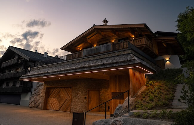 illuminated luxury chalet exterior