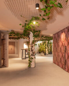 Hotel gallery and pink floral wallpaper.
