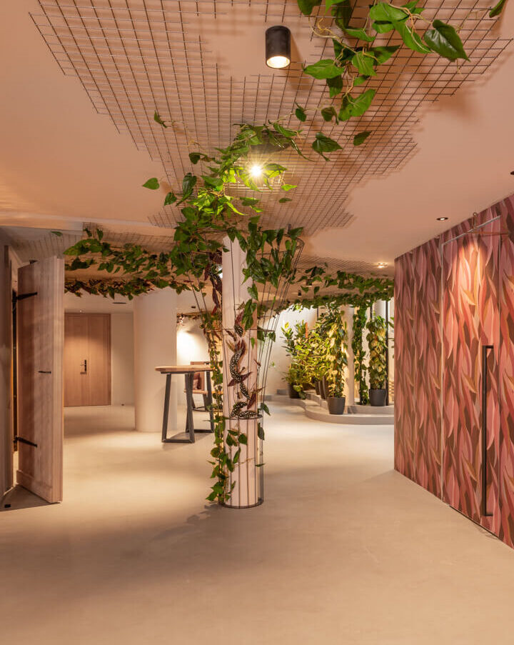 Hotel gallery and pink floral wallpaper.