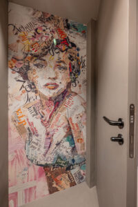 Photo wallpaper featuring a colorful portrait of a woman as modern wall decoration.