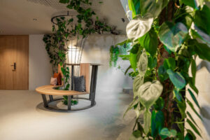 Hotel gallery with a modern design lounge table made of oak and steel.