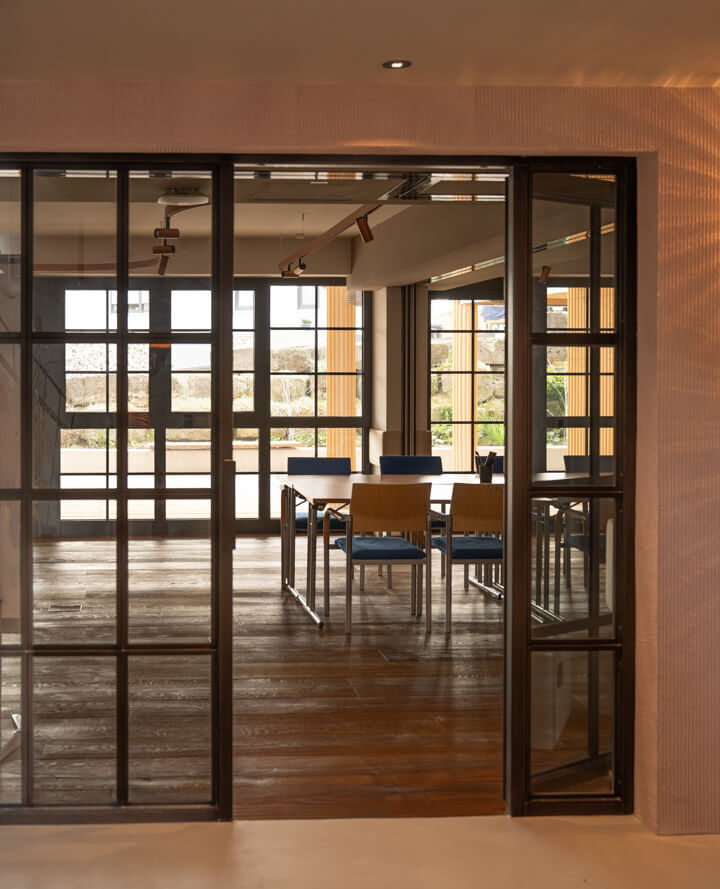 Loft-style doors leading to the conference room.