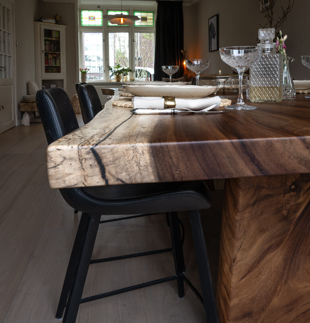 Acacia table made from a single solid top and matching solid end panel.