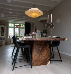 Acacia table made from a single solid top and matching solid end panel.