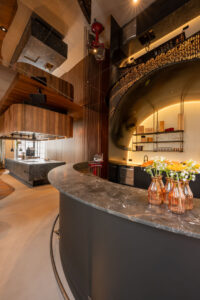 Hotel bar counter in natural grey stone.