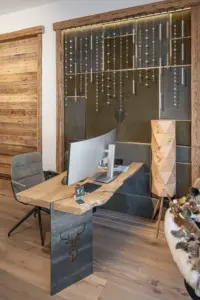 Oak desk and green leather wall plus Swarovski lighting