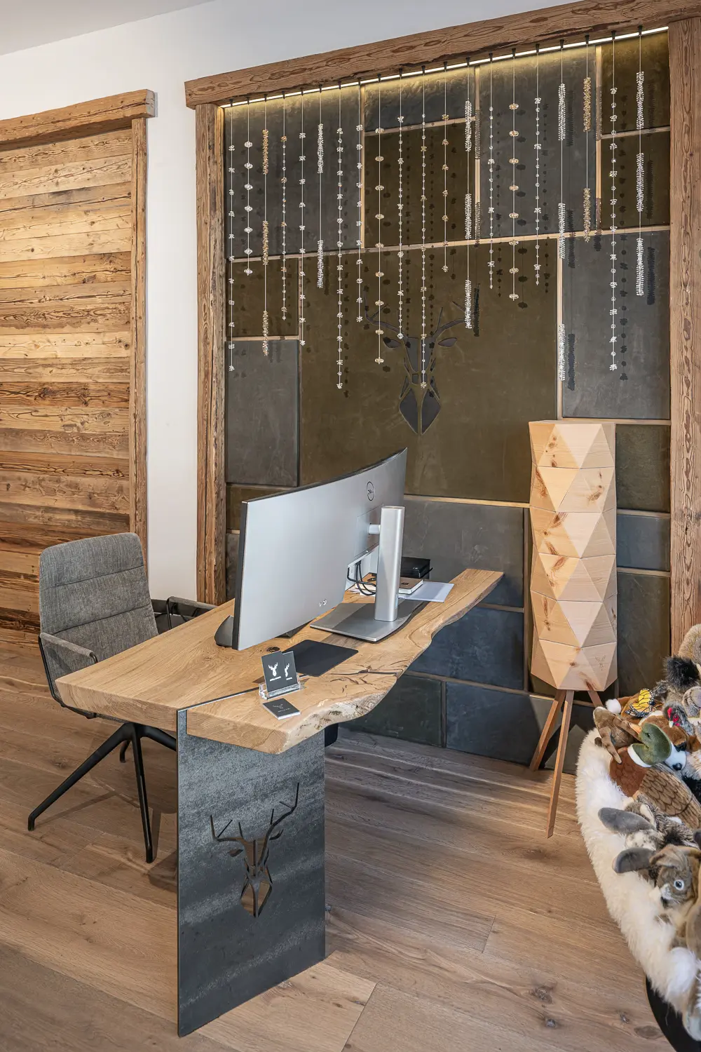 Oak desk and green leather wall plus Swarovski lighting