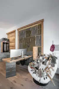 Oak desk and green leather wall plus Swarovski lighting