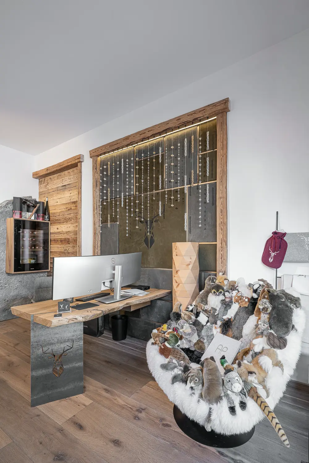 Oak desk and green leather wall plus Swarovski lighting