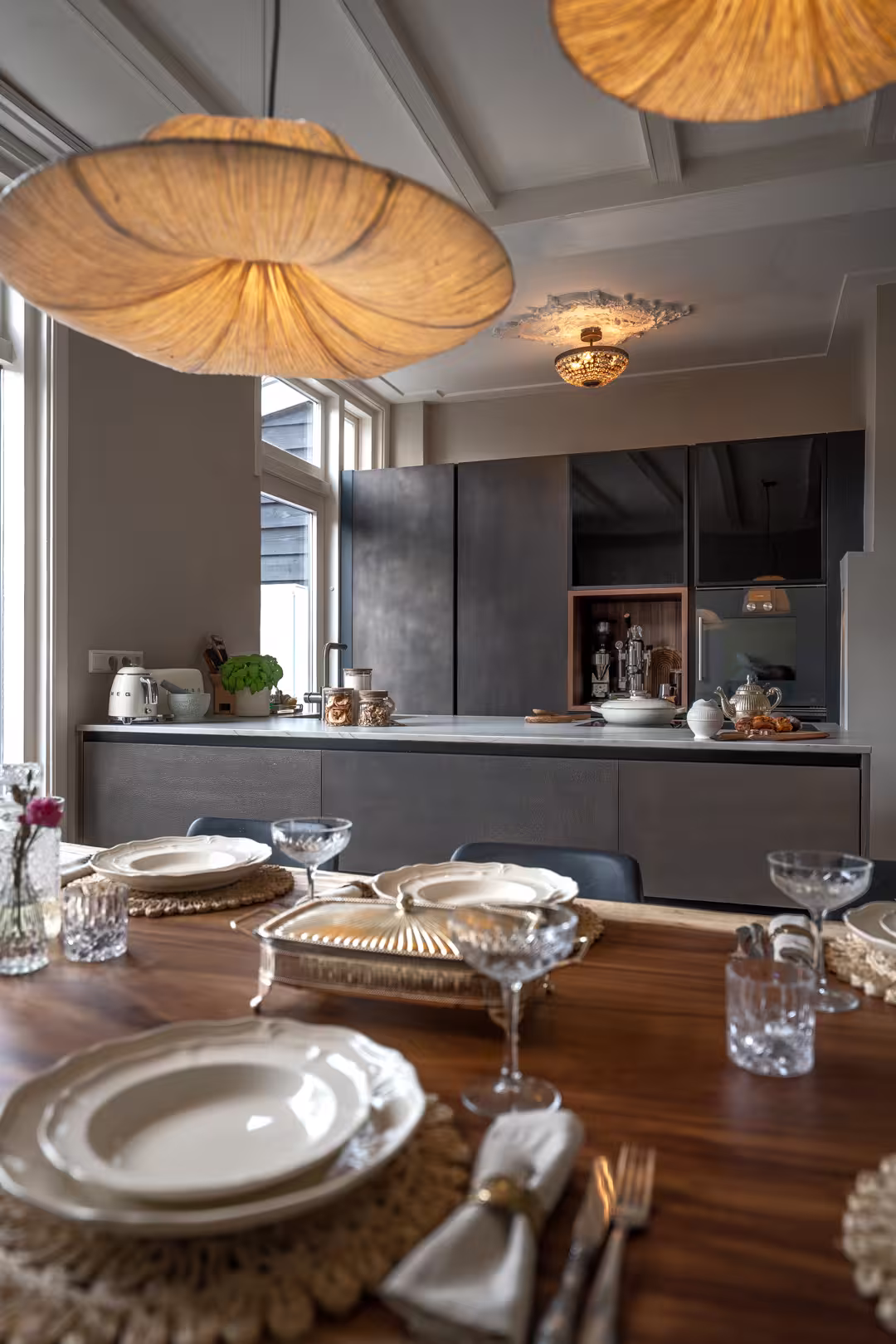 Bronze kitchen and an acacia table